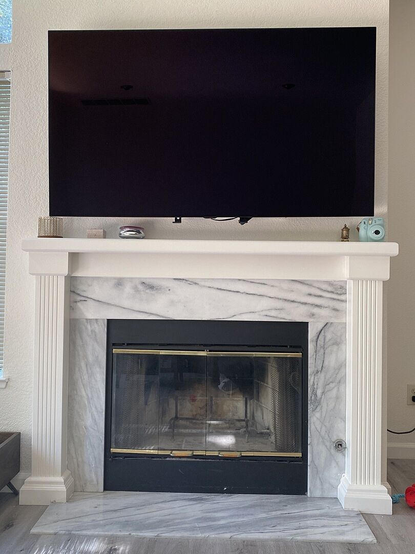 MantelMount MM340 Standard Above Fireplace Pull Down TV Mount