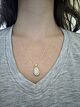 Floating Opal and Diamond Halo Pendant with Butterfly Motif