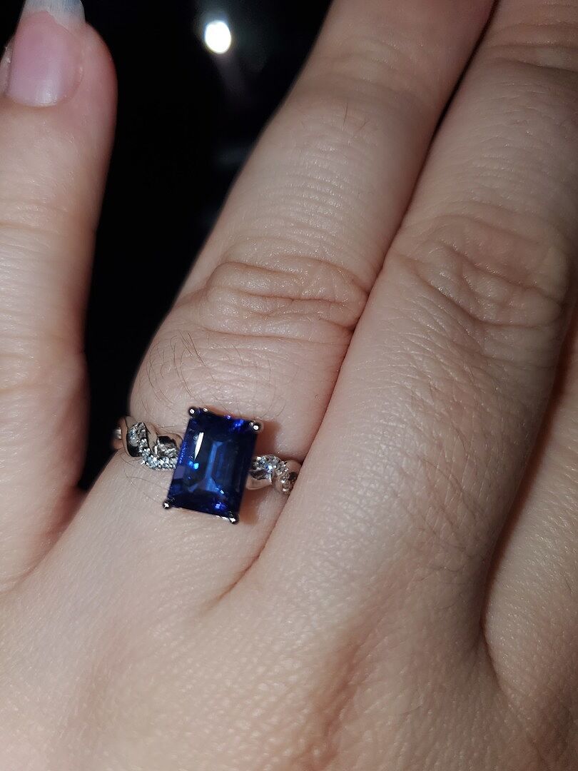 Emerald-Cut Solitaire Tanzanite Infinity Twist Ring