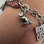 James selling Avery T-Rex charm. Small