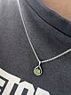 Peridot infinity twist pendant