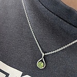 Peridot infinity twist pendant