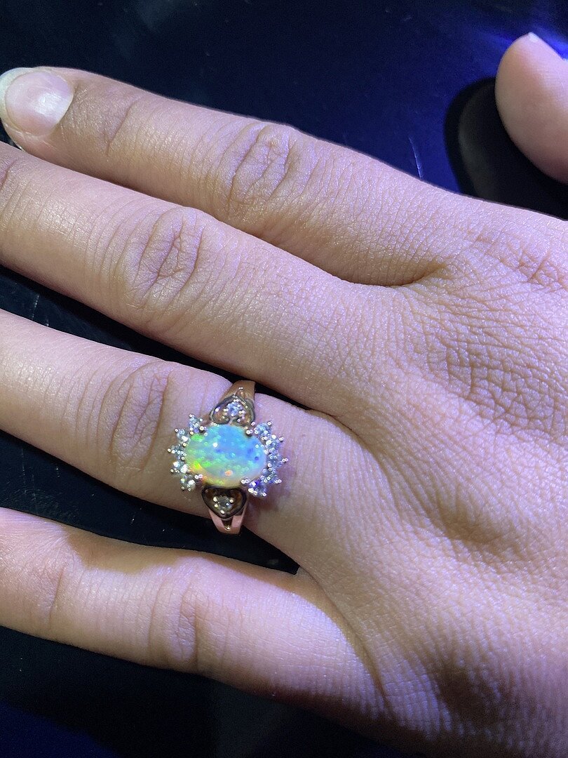 Vintage Inspired Oval Opal Halo Ring with Heart Motifs