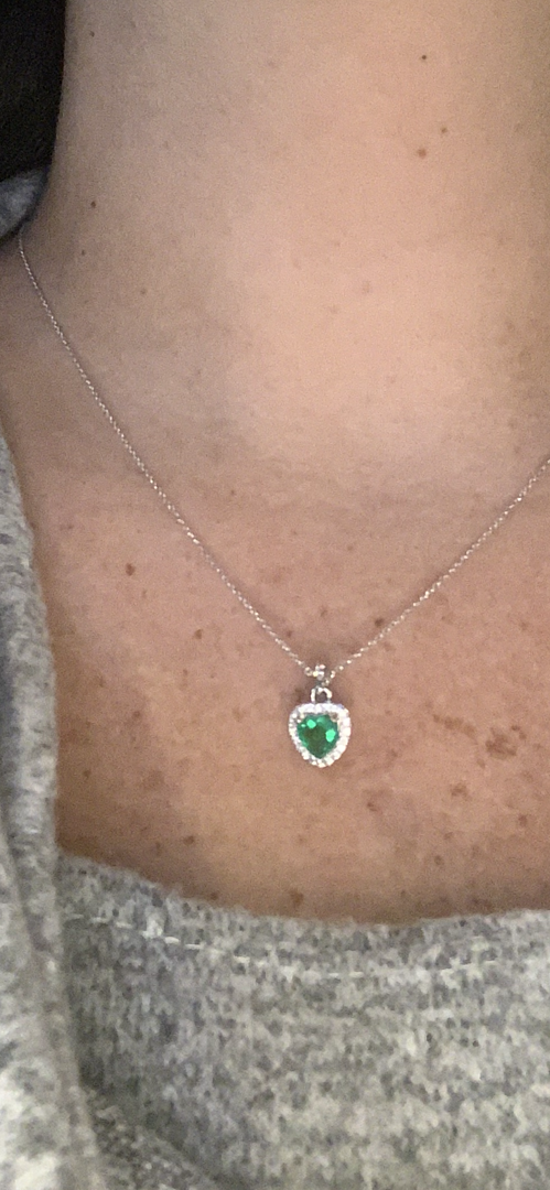 Heart emerald pendant with diamond halo