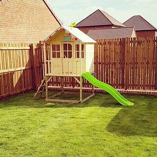 tp hill top wooden tower playhouse with slide