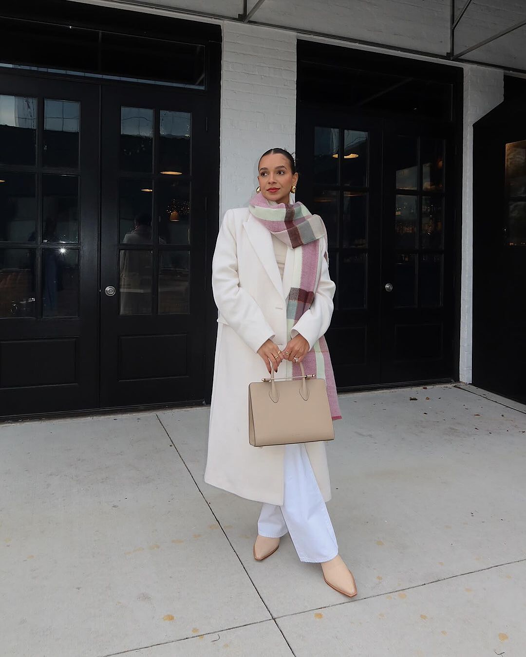 Erika carries the Strathberry Midi Tote - Oat