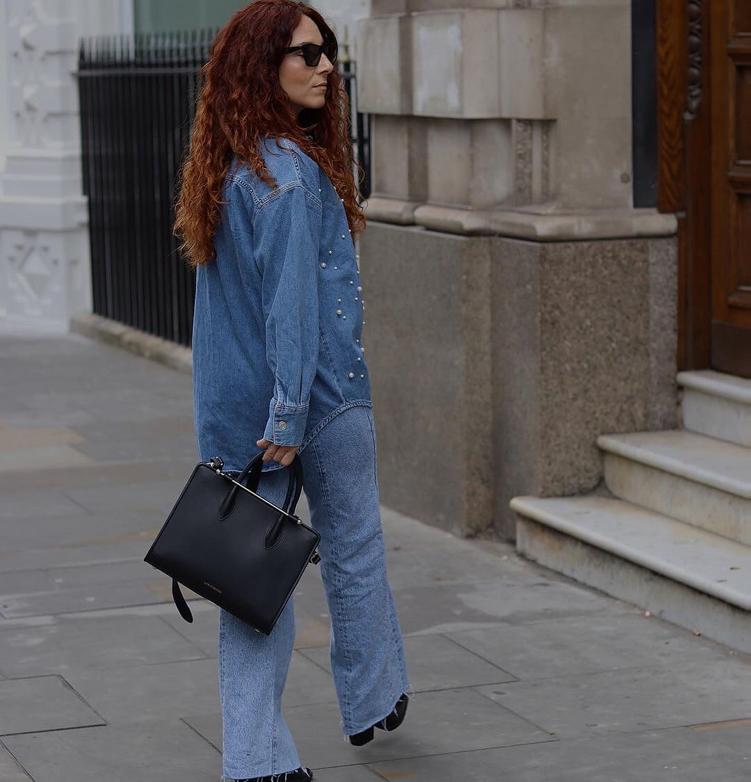 Gemma wears the The Strathberry Midi Tote - Black